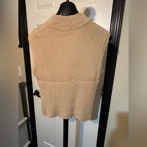 George crew neck, sleeveless  knit sweater.